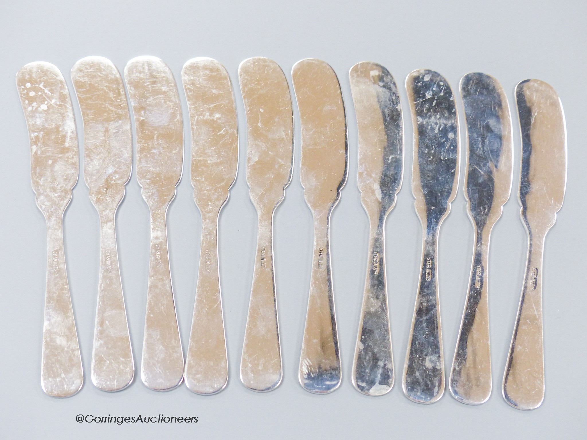 A set of ten modern sterling 925 butter knives, 14.9cm, 9oz.